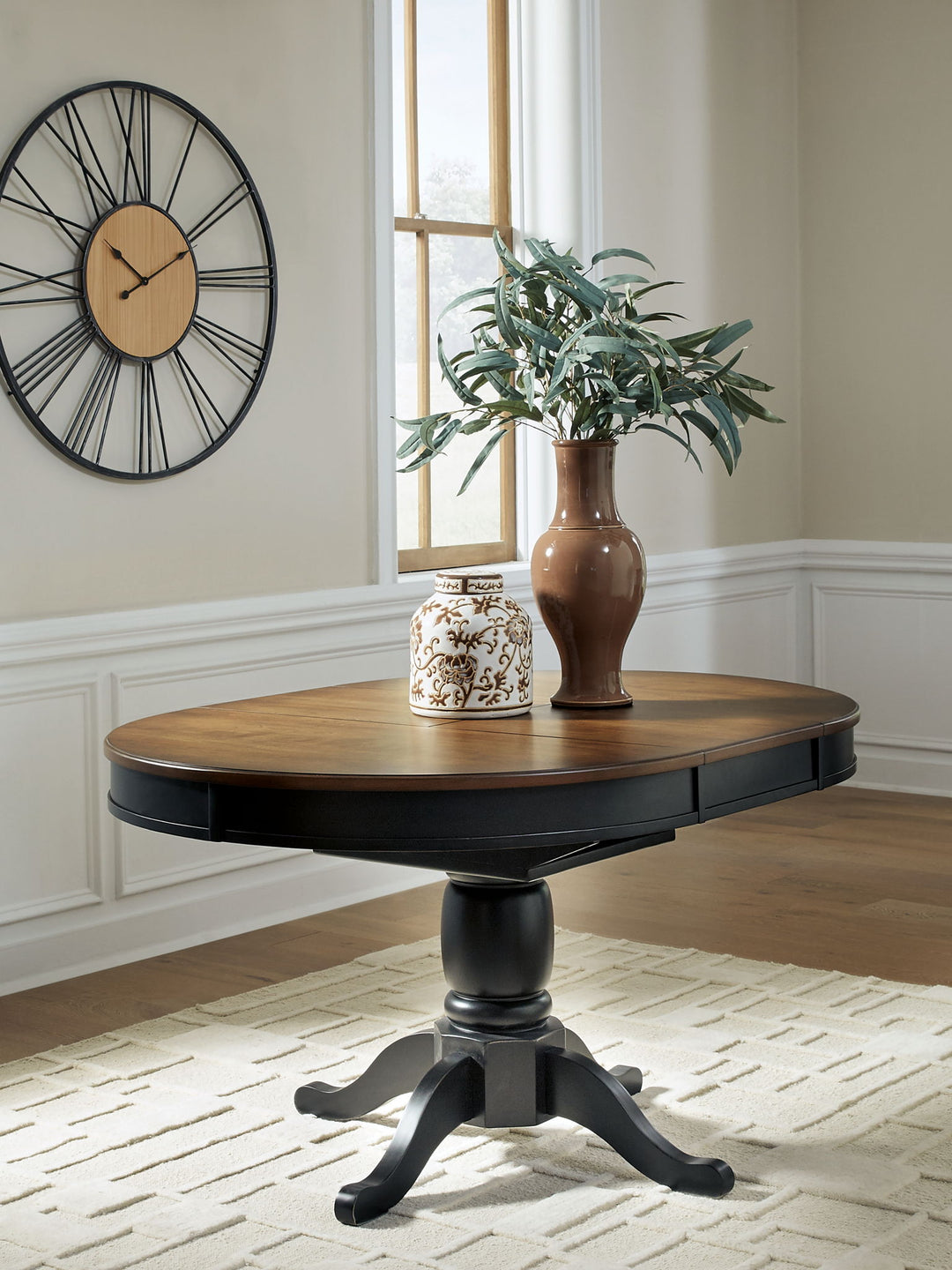Clorazi - Oval Dining Room Butterfly Extension Table - Black / Brown