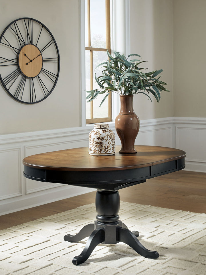 Clorazi - Oval Dining Room Butterfly Extension Table - Black / Brown